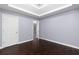 Light and airy bedroom with hardwood floors and access to hallway at 1598 Blue Spruce Ln, Conyers, GA 30012