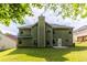 Two-story house with green siding and a backyard at 1598 Blue Spruce Ln, Conyers, GA 30012