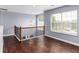 Spacious landing area with hardwood floors and a view to the lower level at 1598 Blue Spruce Ln, Conyers, GA 30012