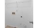 Laundry room with built-in shelving and hookups at 1598 Blue Spruce Ln, Conyers, GA 30012