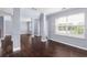 Spacious living room with hardwood floors and neutral walls at 1598 Blue Spruce Ln, Conyers, GA 30012