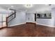 Spacious living room with hardwood floors and a view of the kitchen at 1598 Blue Spruce Ln, Conyers, GA 30012