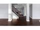 Dark hardwood floors and a modern staircase in a home at 1598 Blue Spruce Ln, Conyers, GA 30012
