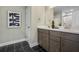 Double vanity bathroom with dark brown cabinets and matte black hardware at 165 Poppy St, Mcdonough, GA 30253