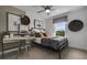 Modern bedroom with a desk, window seat, and stylish decor at 165 Poppy St, Mcdonough, GA 30253
