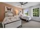 Charming bedroom with twin beds, butterfly art, and natural light at 165 Poppy St, Mcdonough, GA 30253
