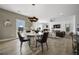 Modern dining area with large windows and natural light at 165 Poppy St, Mcdonough, GA 30253