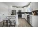 Modern kitchen with stainless steel appliances and white cabinets at 165 Poppy St, Mcdonough, GA 30253