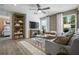 Spacious living room with wood flooring, sectional sofa, and large window at 165 Poppy St, Mcdonough, GA 30253