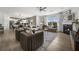 Open living space with hardwood floors, fireplace, and kitchen view at 165 Poppy St, Mcdonough, GA 30253
