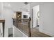 Loft overlooking living area with wood flooring and railing at 165 Poppy St, Mcdonough, GA 30253