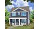 Two-story craftsman style home with blue siding, white trim, and a front porch at 29 Hydrangea Unit 72 Way, Auburn, GA 30011