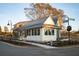 Charming white cottage with a metal roof and black windows at 29 Hydrangea Unit 72 Way, Auburn, GA 30011