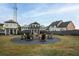 Community fire pit with Adirondack chairs at 29 Hydrangea Unit 72 Way, Auburn, GA 30011