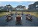 Community fire pit with Adirondack chairs at 29 Hydrangea Unit 72 Way, Auburn, GA 30011