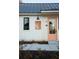 Modern farmhouse exterior with peach front door and black windows at 29 Hydrangea Unit 72 Way, Auburn, GA 30011