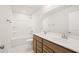 Bathroom boasts double vanity, tub shower combo, and updated fixtures at 305 Foxglove Way, Mcdonough, GA 30253