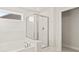 Bathroom with shower and bathtub at 305 Foxglove Way, Mcdonough, GA 30253