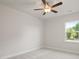 Bright bedroom with ceiling fan and neutral carpeting at 305 Foxglove Way, Mcdonough, GA 30253