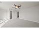 Spacious bedroom with ceiling fan and closet at 305 Foxglove Way, Mcdonough, GA 30253