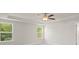 Bright bedroom with ceiling fan and large windows at 305 Foxglove Way, Mcdonough, GA 30253