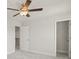 Well-lit bedroom featuring ceiling fan,door to hallway and closet at 305 Foxglove Way, Mcdonough, GA 30253