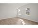 Spacious dining room with hardwood floors and large windows at 305 Foxglove Way, Mcdonough, GA 30253