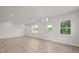 Spacious dining room with hardwood floors and lots of natural light at 305 Foxglove Way, Mcdonough, GA 30253