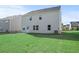 Rear view of house, showcasing backyard and patio at 305 Foxglove Way, Mcdonough, GA 30253