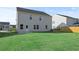 Rear view of house, showcasing backyard and patio at 305 Foxglove Way, Mcdonough, GA 30253