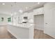 Modern kitchen with white cabinets and quartz countertops at 305 Foxglove Way, Mcdonough, GA 30253