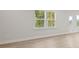 Bright living room with hardwood floors and natural light at 305 Foxglove Way, Mcdonough, GA 30253