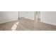 Hardwood floor living room with access to kitchen at 305 Foxglove Way, Mcdonough, GA 30253