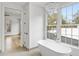 Bathroom with free-standing tub and large window at 92 Sheridan Dr, Atlanta, GA 30305