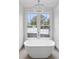 Elegant bathroom boasting a free-standing tub and chandelier at 92 Sheridan Dr, Atlanta, GA 30305