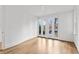 Bright bedroom with hardwood floors and French doors leading to the backyard at 92 Sheridan Dr, Atlanta, GA 30305