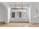 Spacious dining room with hardwood floors and a large chandelier at 92 Sheridan Dr, Atlanta, GA 30305