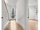 Elegant curved hallway with hardwood floors and access to backyard at 92 Sheridan Dr, Atlanta, GA 30305