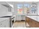 Modern kitchen with white cabinets, stainless steel appliances, and hardwood floors at 92 Sheridan Dr, Atlanta, GA 30305