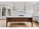 Modern kitchen with a large island, white cabinets and hardwood floors at 92 Sheridan Dr, Atlanta, GA 30305
