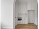 Small kitchen area with white cabinets and built in microwave at 92 Sheridan Dr, Atlanta, GA 30305