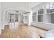 Open living room with hardwood floors and access to a deck at 92 Sheridan Dr, Atlanta, GA 30305