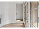 Hardwood floors, staircase, and French doors to deck at 92 Sheridan Dr, Atlanta, GA 30305