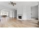 Living area with hardwood floors, fireplace, and staircase at 92 Sheridan Dr, Atlanta, GA 30305