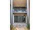 Stone patio with dark-framed French doors and a metal railing at 92 Sheridan Dr, Atlanta, GA 30305
