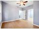 Spacious bedroom with grey walls, wood-look flooring, and multiple entries at 1382 Elizabeth Ln, East Point, GA 30344