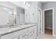 This bathroom includes double sinks with granite counters and a glass shower at 316 Foxglove Way, Mcdonough, GA 30253
