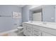 Bathroom with double sinks, modern fixtures and an elegant design at 316 Foxglove Way, Mcdonough, GA 30253