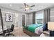 This bedroom includes a large window and en-suite bath and walk in closet at 316 Foxglove Way, Mcdonough, GA 30253