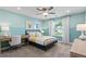 Bright bedroom with a large window, desk and modern decor at 316 Foxglove Way, Mcdonough, GA 30253